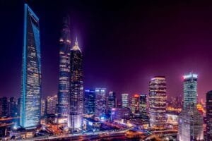 Majestic view of Shanghai's illuminated skyline featuring iconic skyscrapers at night.
